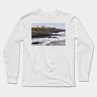 Waves battering the coast near Dustanburgh castle Northumberland, UK Long Sleeve T-Shirt